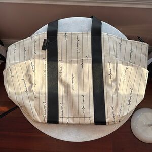 Victoria’s Secret cream and black zip up tote bag